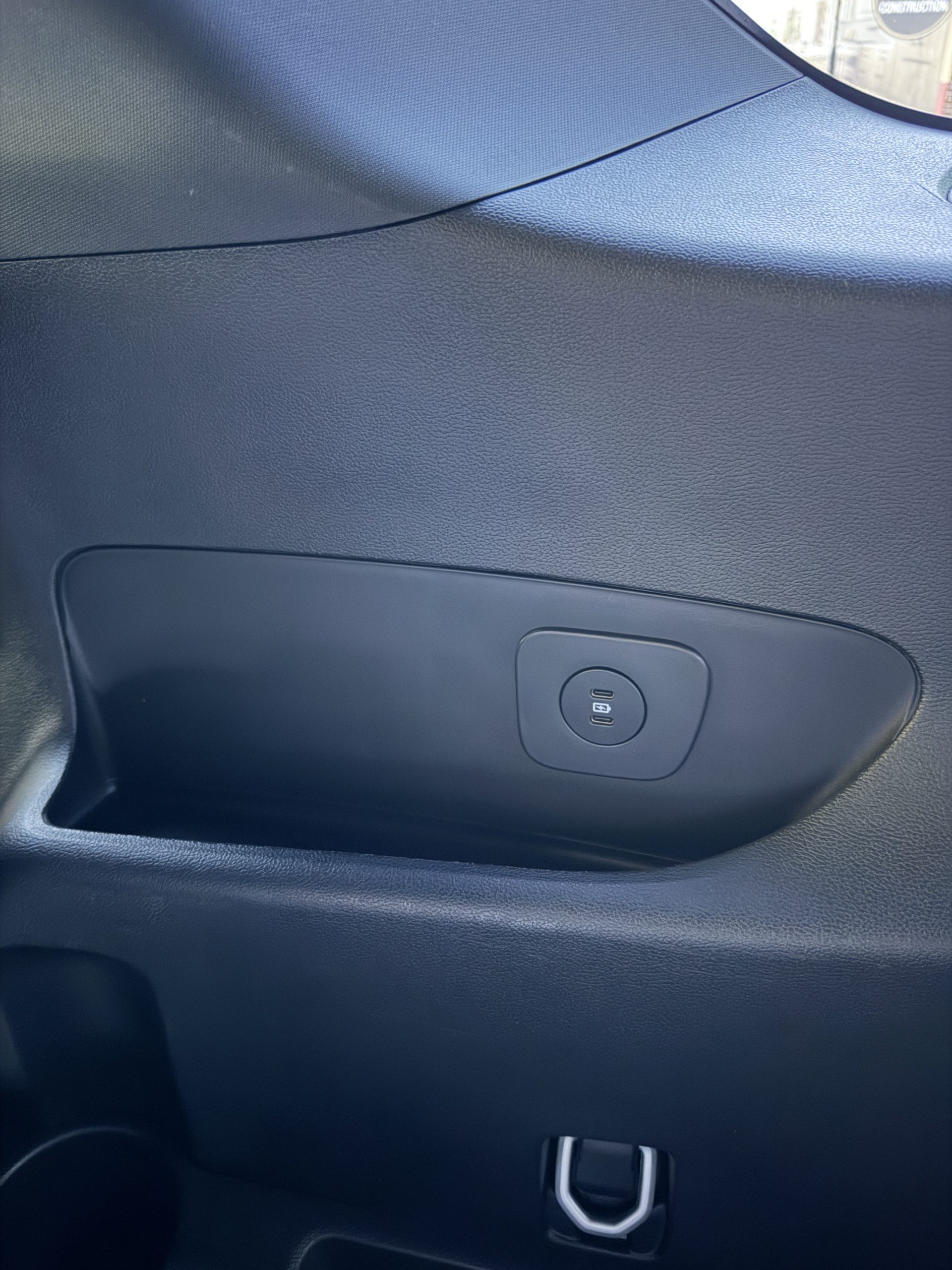 Two USB-C charging ports beside the rear seating area.